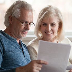 couple holding documents