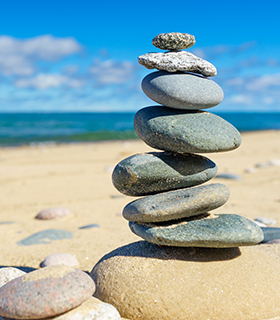 balancing rocks on the beach