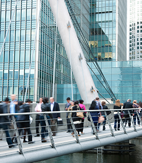 people walking over a bridge