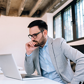 man looking on laptop