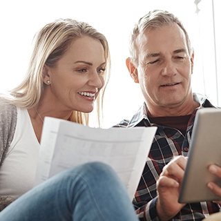 couple looking at a tablet