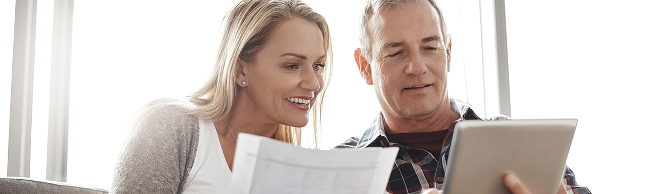 a man and a woman reviewing documents