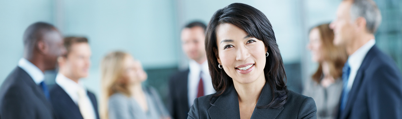 Business woman with her team in the background