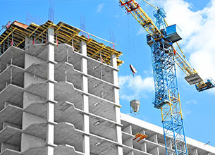 crane above an incomplete concrete structure