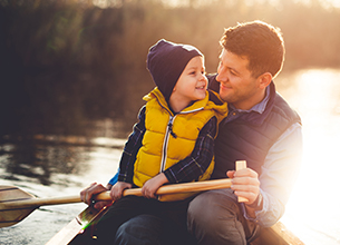 father and son in a canoe