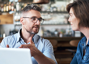 man and woman having a discussion