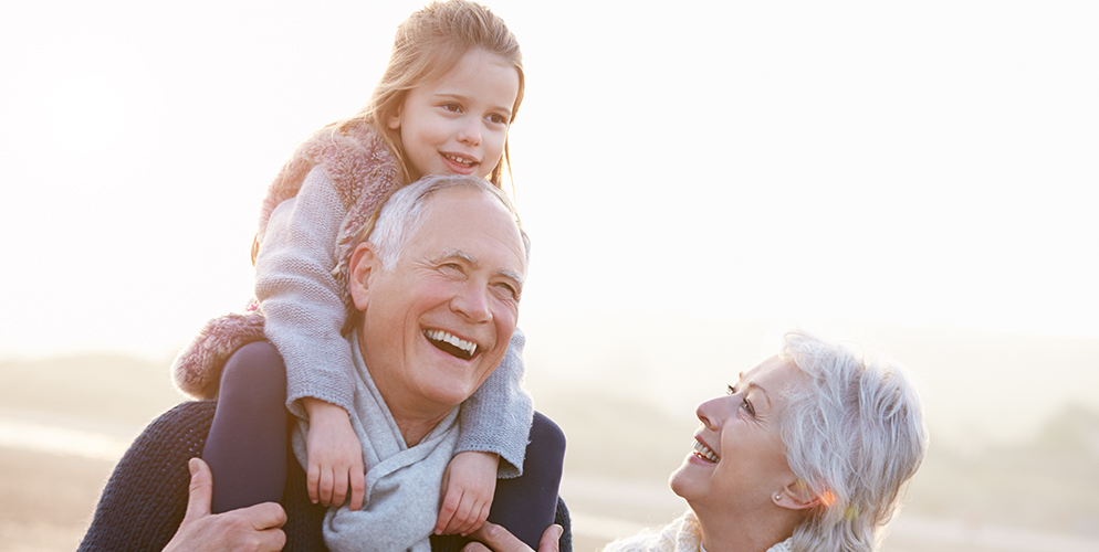 mature couple and young child