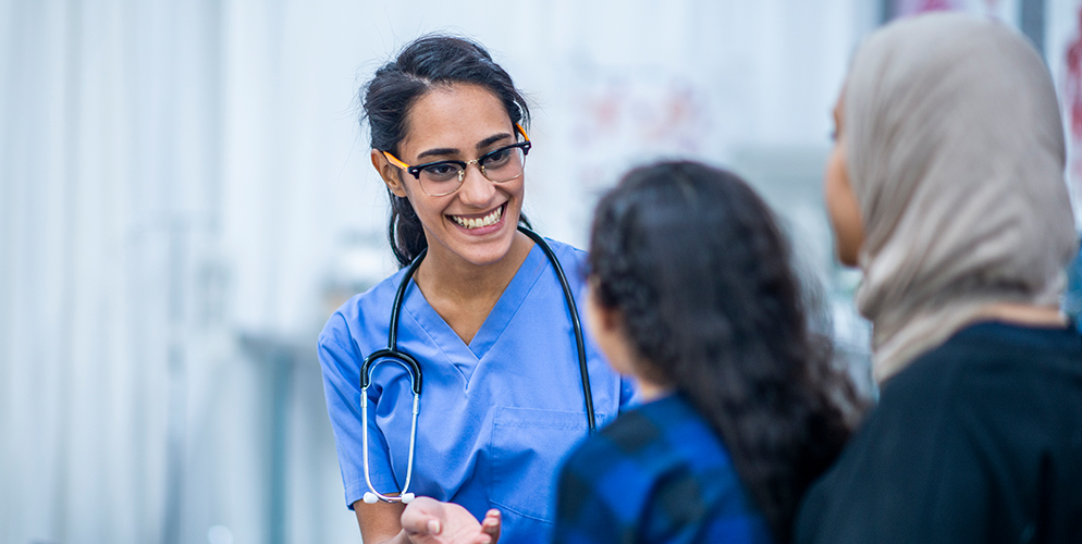 Doctor consulting with patients