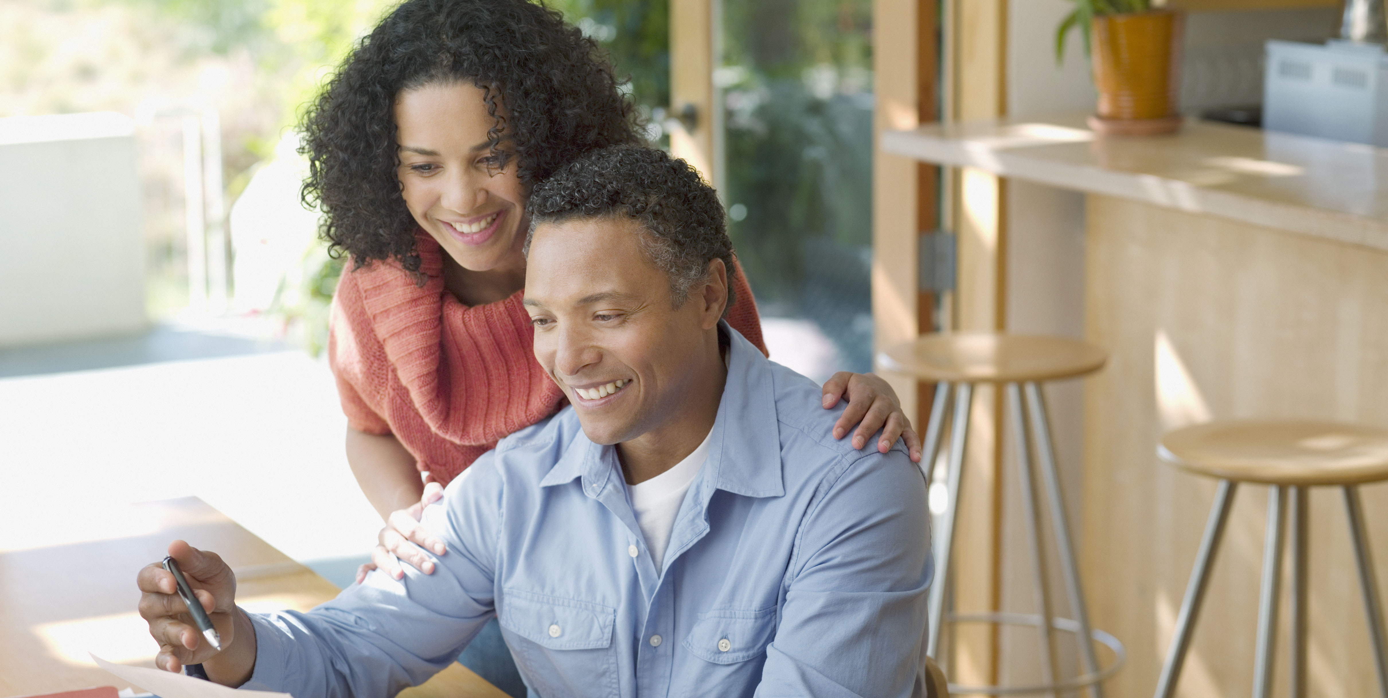 mature couple looking at paperwork