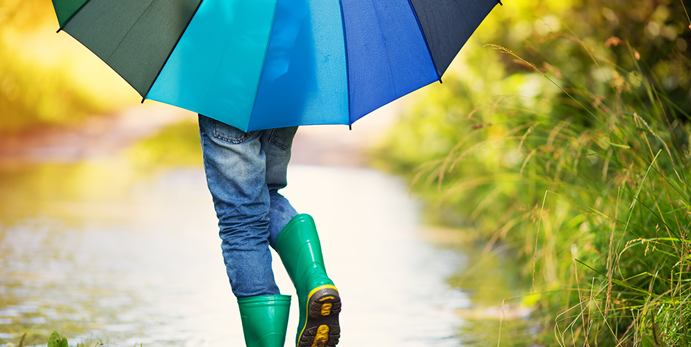 child playing in rain