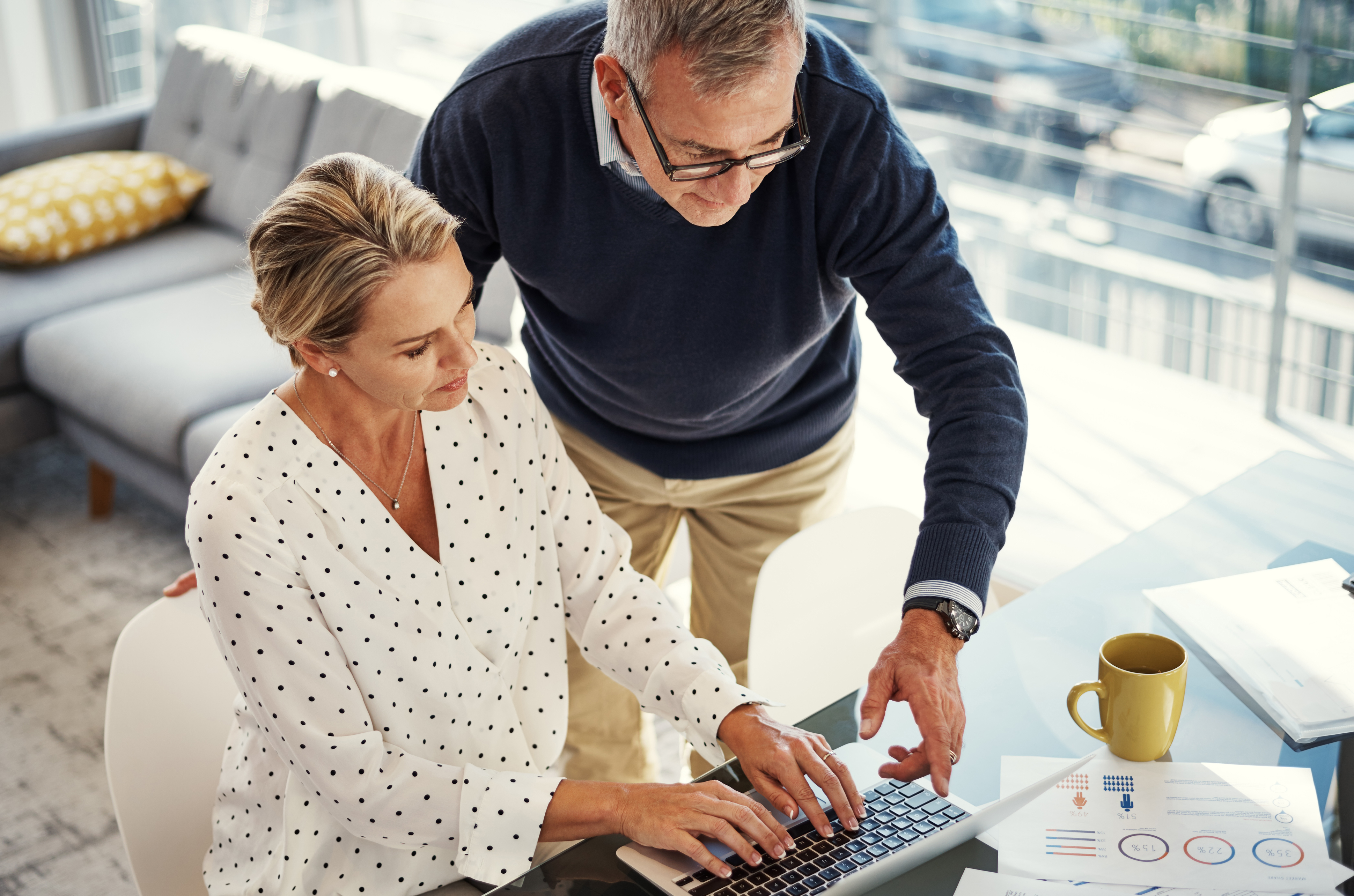 woman and man reviewing financial statements