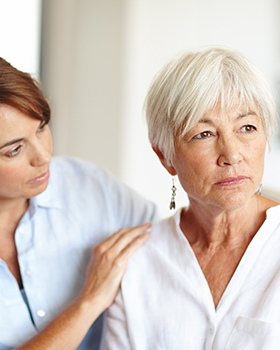 woman helping elder woman