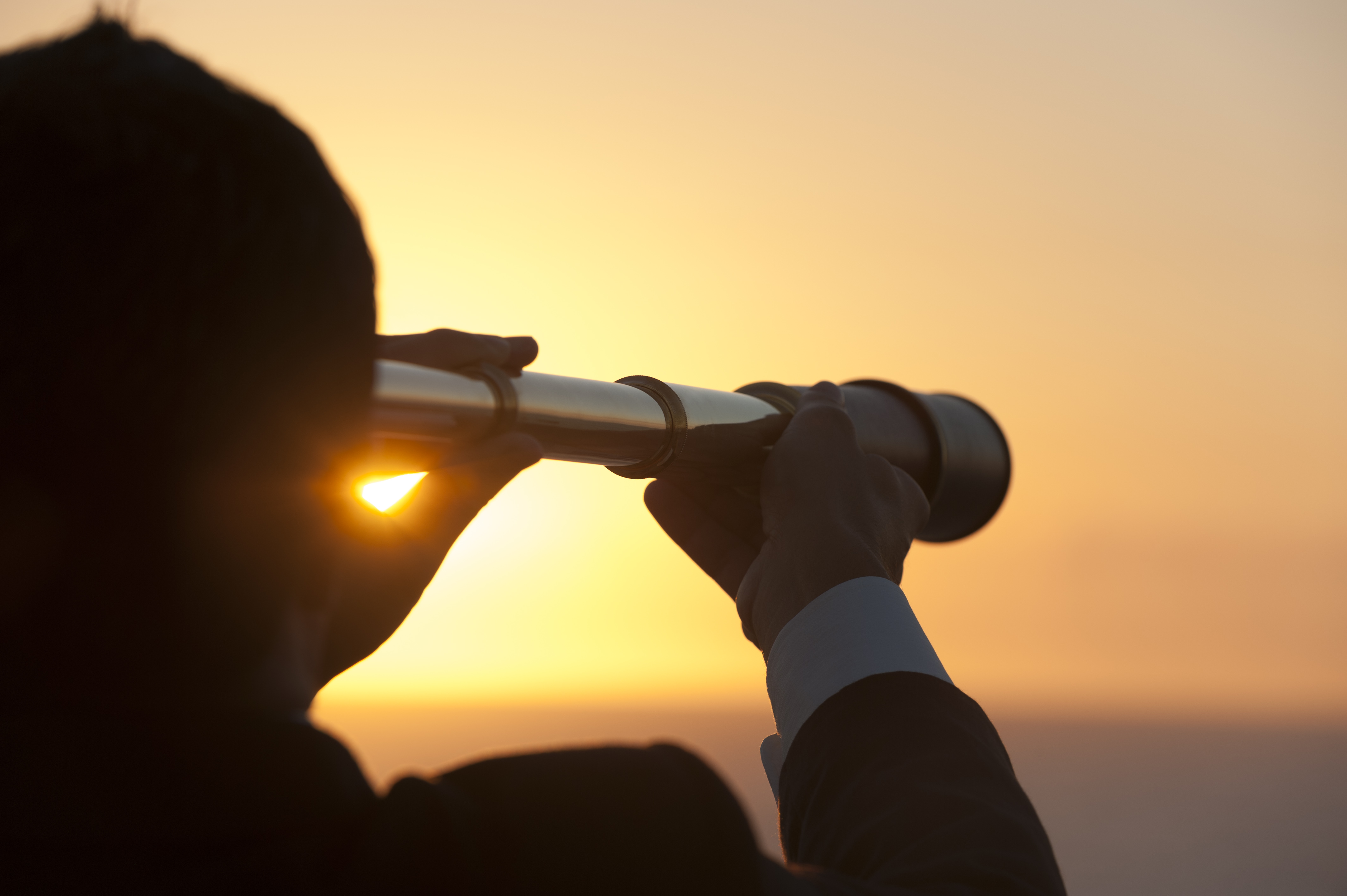 sunset, man looking through telescope