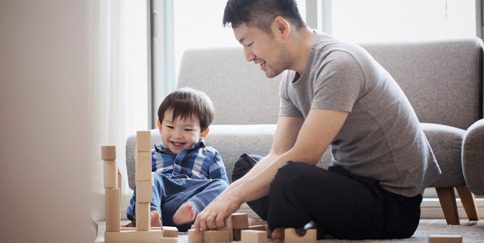 man and son playing