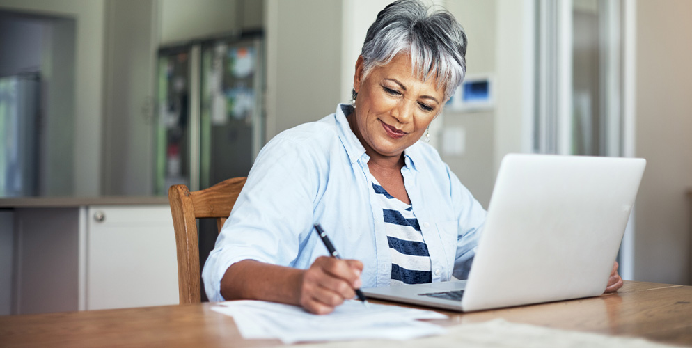 woman looking at her computer