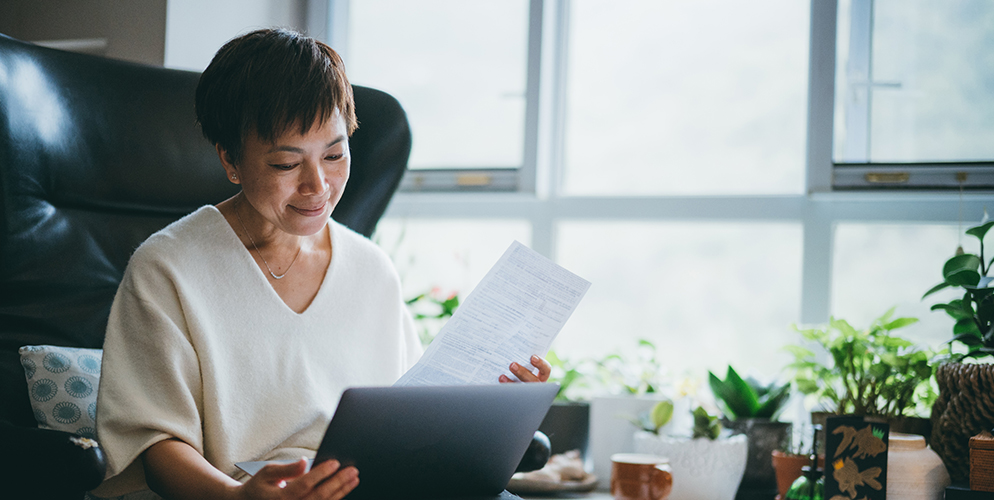 woman looking at financial documents