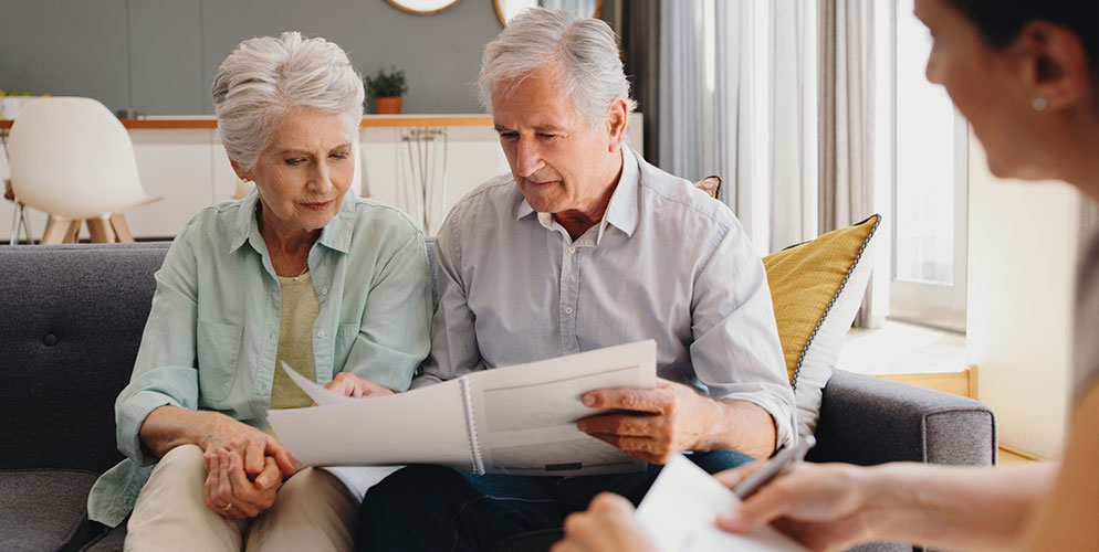 woman and man reviewing financial statements