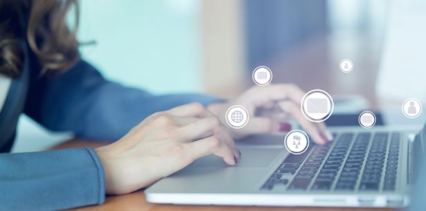 woman on computer with abstract design