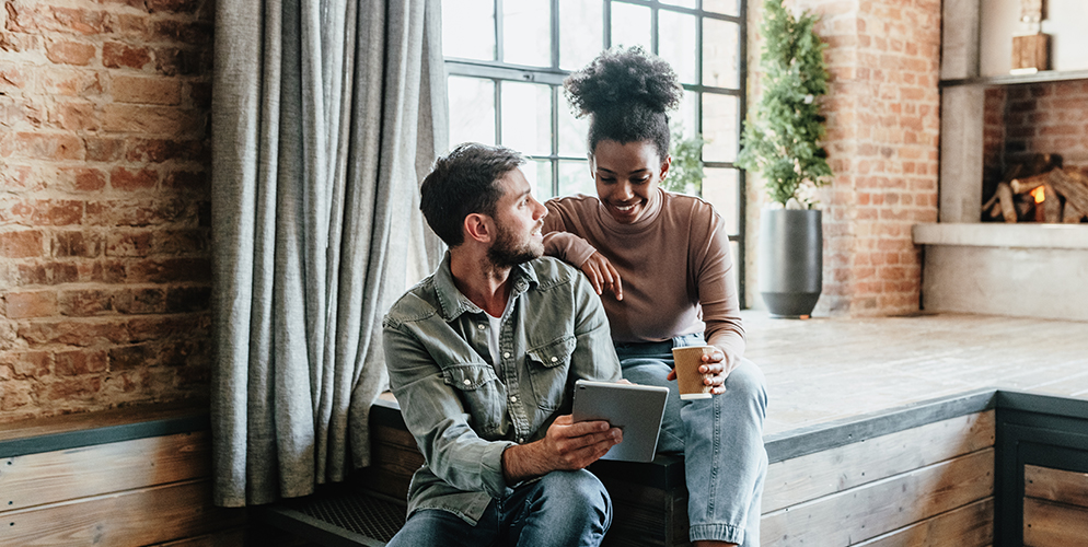 couple discussing over ipad